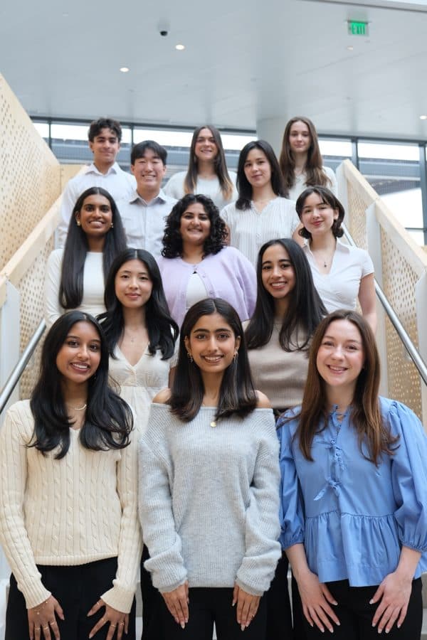 The Design Interactive executive board on a staircase